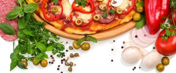 Pizza with mushrooms, sausage and vegetables on white background. Pizza with mushrooms, sausage and vegetables on a white background.