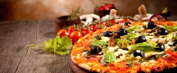 Delicious fresh pizza served on wooden table Delicious fresh pizza served on wooden table